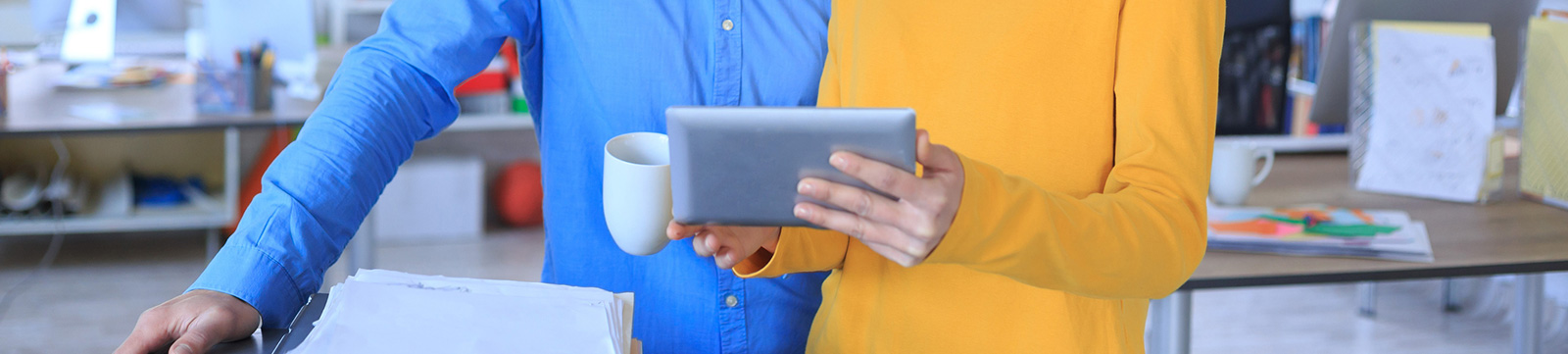 Two business people using tablet
