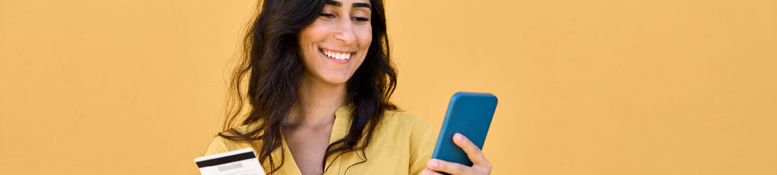 woman on phone with card