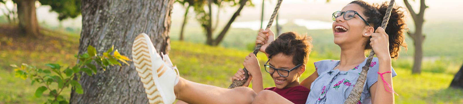children playing on a swingset