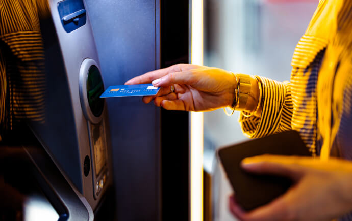 Woman using ATM